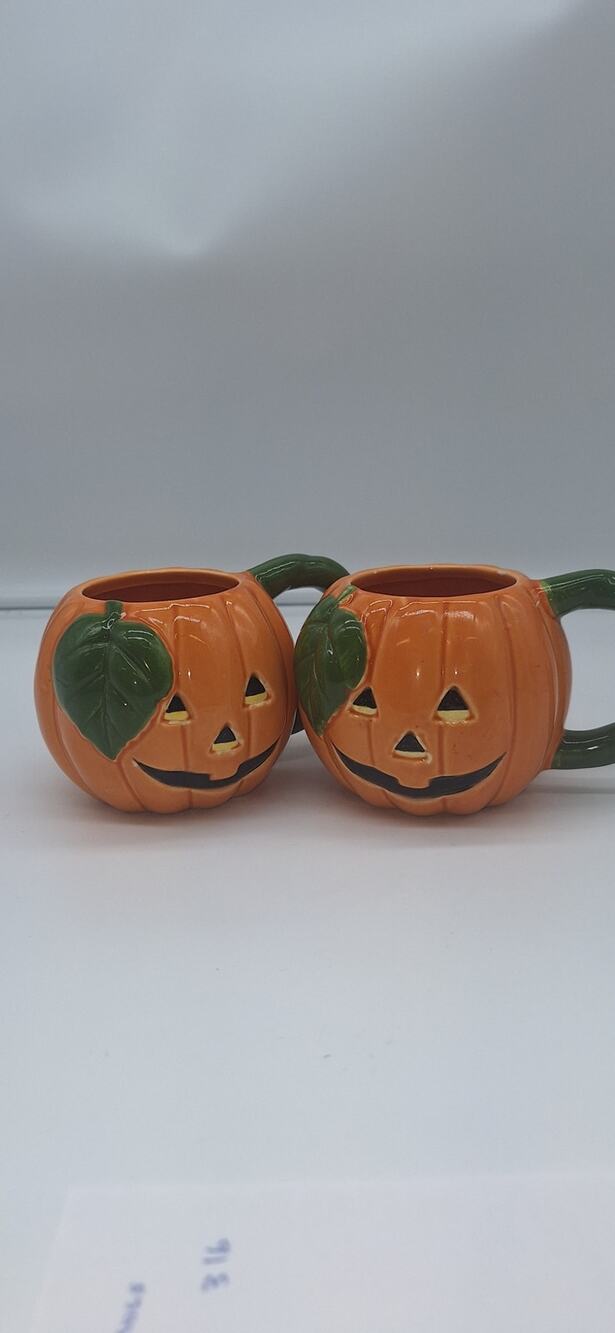 Set of Lillian Vernon Jack O Lantern Ceramic Mugs.